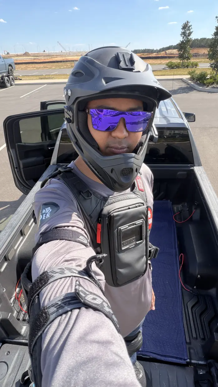 James in full gear beside the truck
