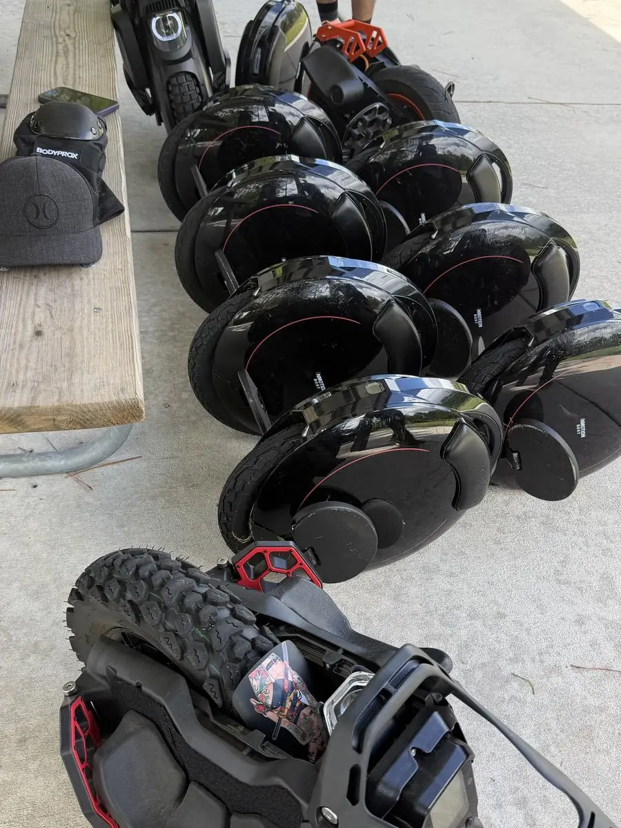 Wheels, pads and helmets laid out on a table before the ride